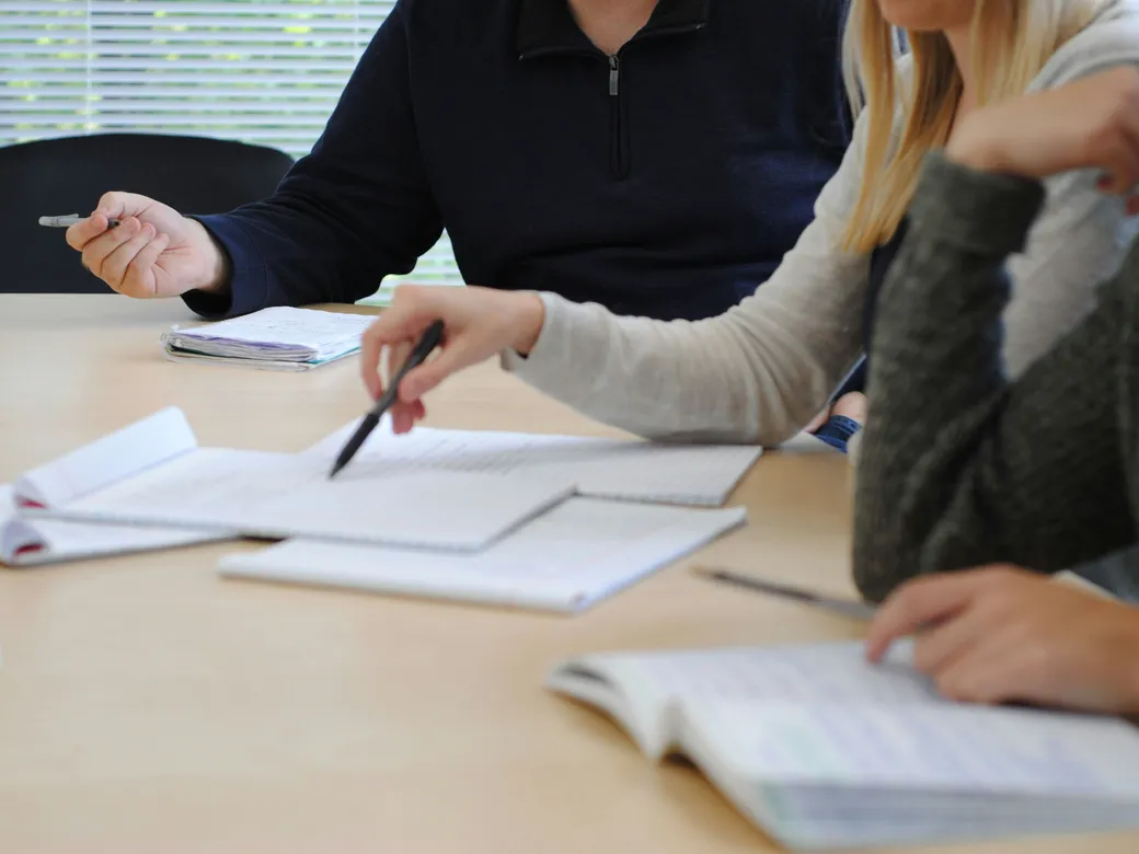 People reviewing trust information together at a table