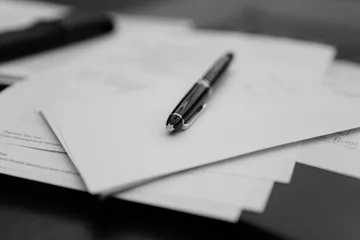Pen resting on estate-planning documents